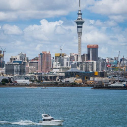 Auckland city skyline at city center and Auckland Sky Tower, the iconic landmark of Auckland, New Zealand.